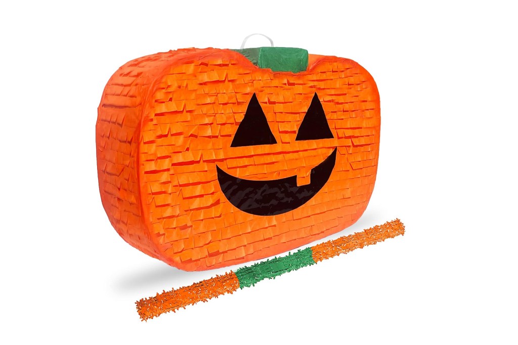 A pinata with a jack-o-lantern face